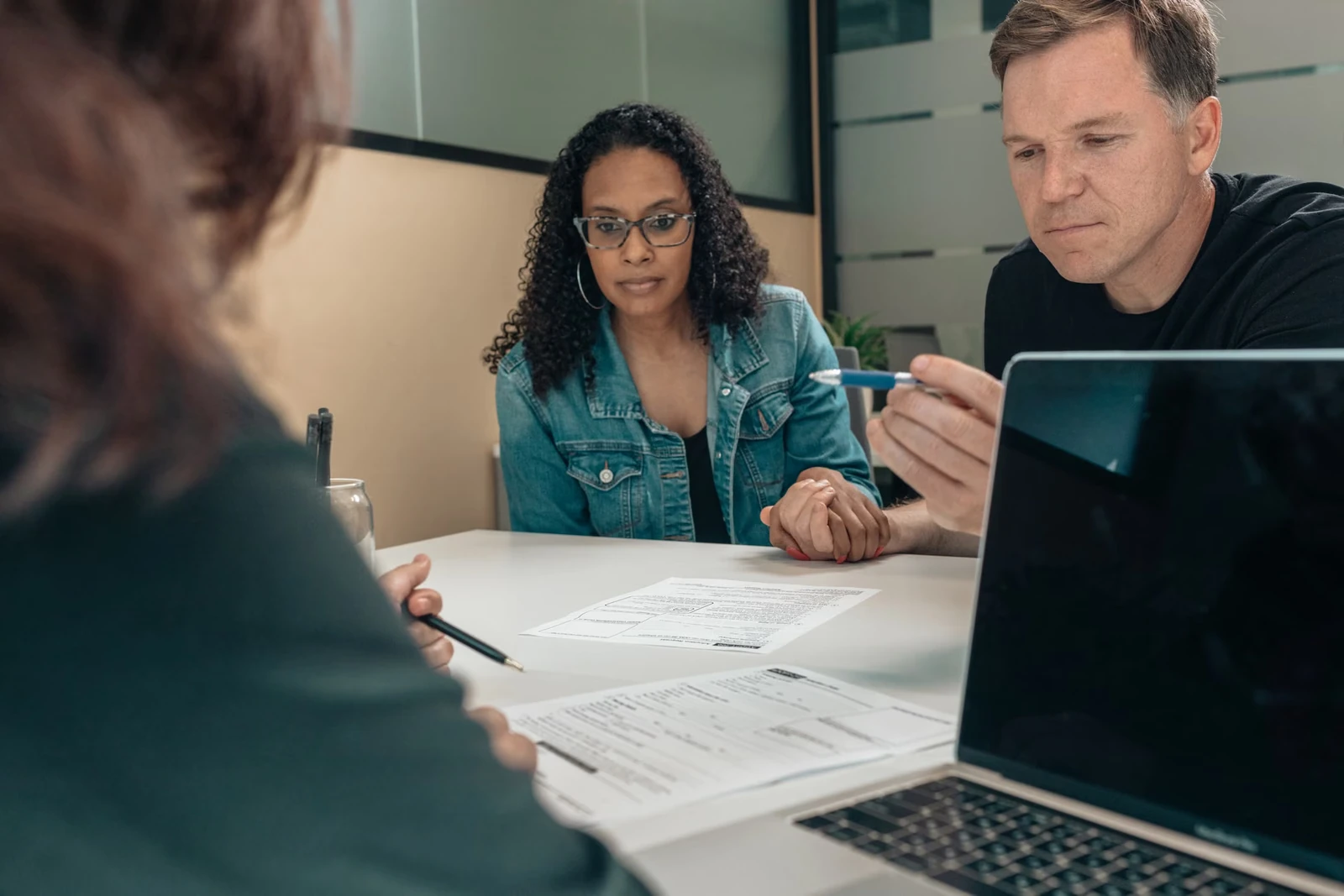 People reviewing coverage documents together